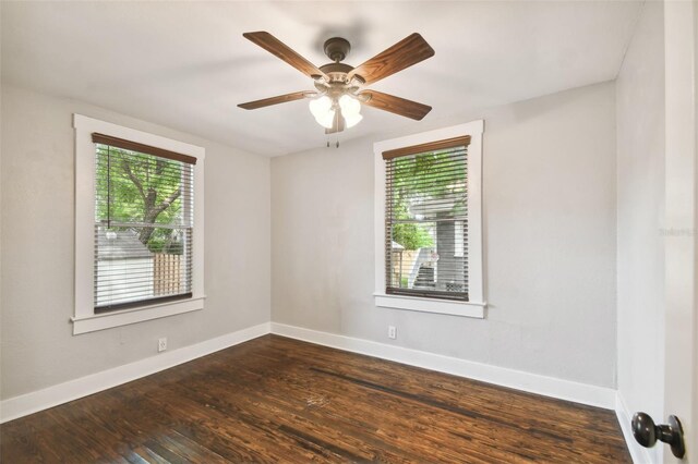 empty room featuring dark hardwood / wood-style floors and ceiling fan