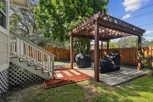 deck with a pergola and a patio