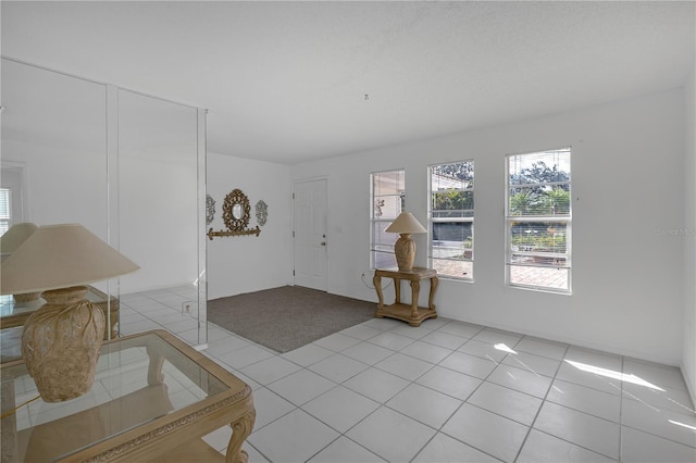 entryway featuring light tile patterned flooring