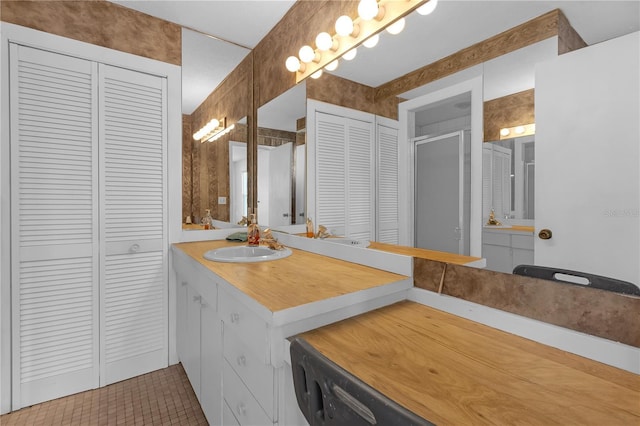 bathroom featuring tile patterned floors and vanity