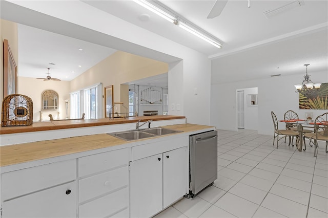 kitchen featuring sink, white cabinetry, dishwasher, ceiling fan with notable chandelier, and hanging light fixtures