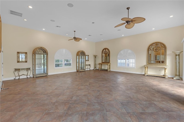 unfurnished living room featuring ceiling fan