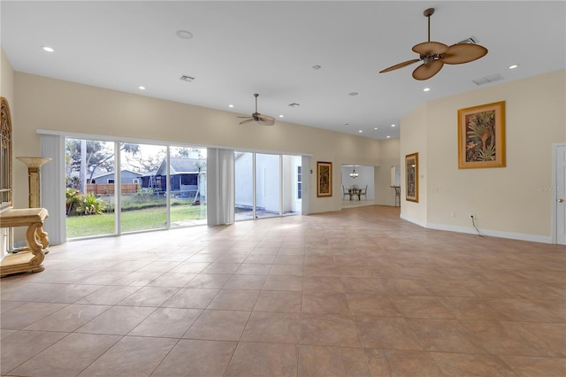 unfurnished living room featuring ceiling fan and light tile patterned flooring