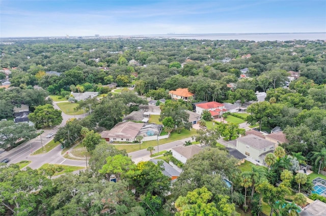 drone / aerial view with a water view and a residential view