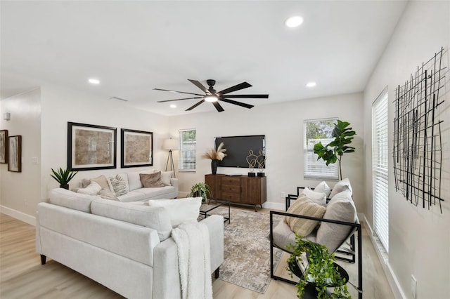 living room with light wood-type flooring, visible vents, recessed lighting, baseboards, and ceiling fan