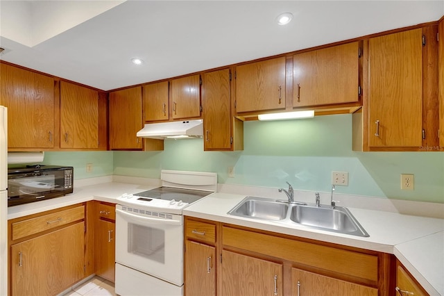 kitchen featuring white range with electric cooktop and sink