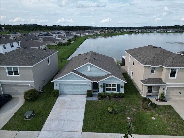 birds eye view of property featuring a water view