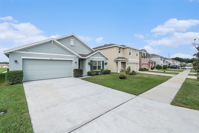 view of front of home with a garage and a front yard