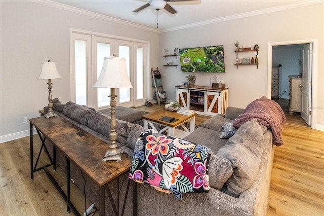 living room with crown molding, ceiling fan, and hardwood / wood-style flooring