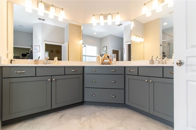 bathroom with walk in shower and vanity