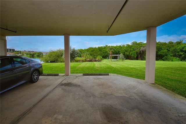 exterior space with a lawn and a water view