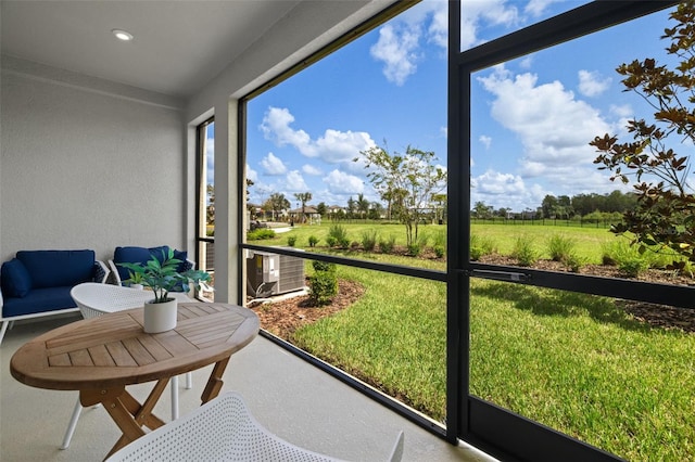 sunroom / solarium with a rural view