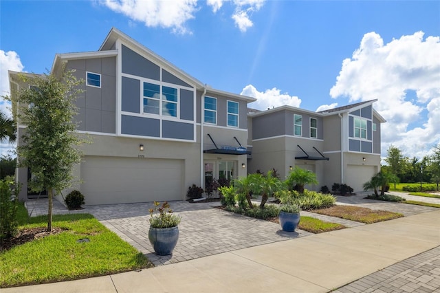 multi unit property featuring a garage