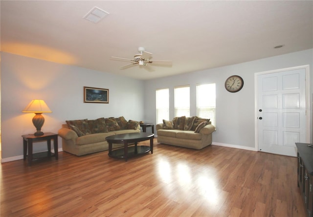 living room with ceiling fan and hardwood / wood-style floors