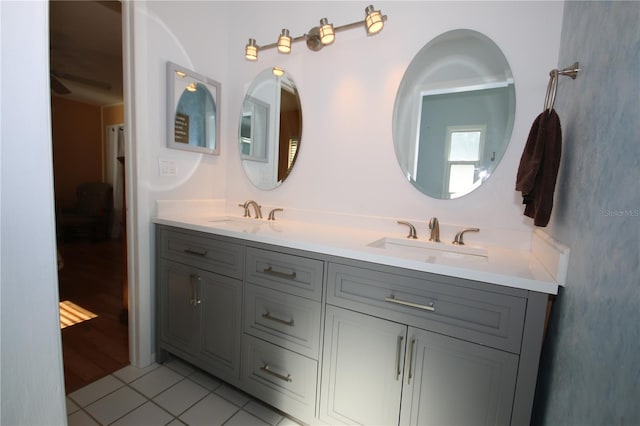 bathroom with tile patterned floors and vanity