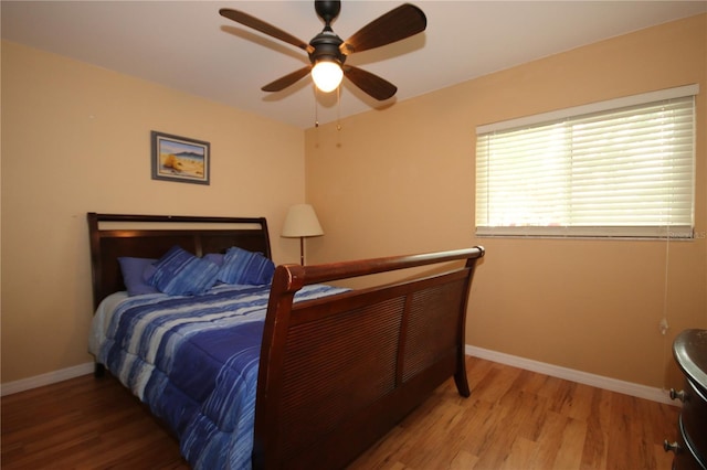 bedroom featuring hardwood / wood-style flooring and ceiling fan