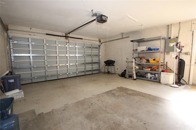 garage with electric panel and a garage door opener