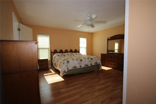 bedroom with ceiling fan and dark wood-type flooring