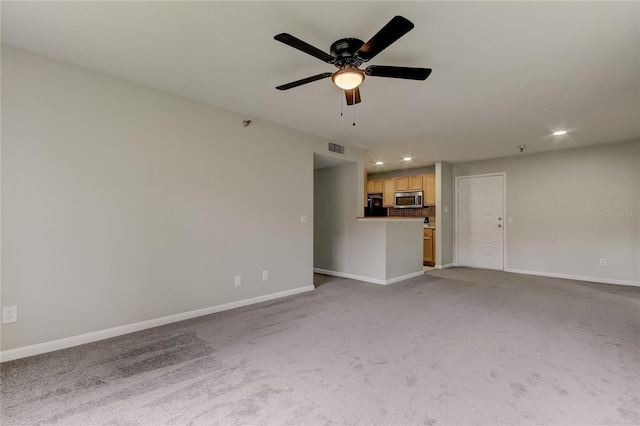 unfurnished living room with light carpet and ceiling fan