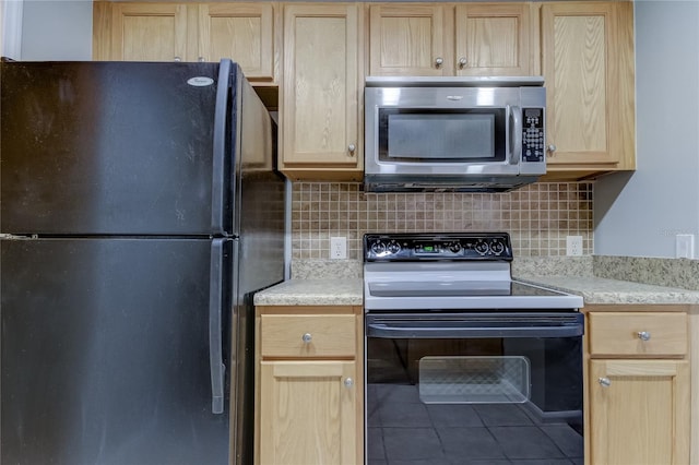 kitchen featuring black appliances, tile patterned flooring, backsplash, and light brown cabinets