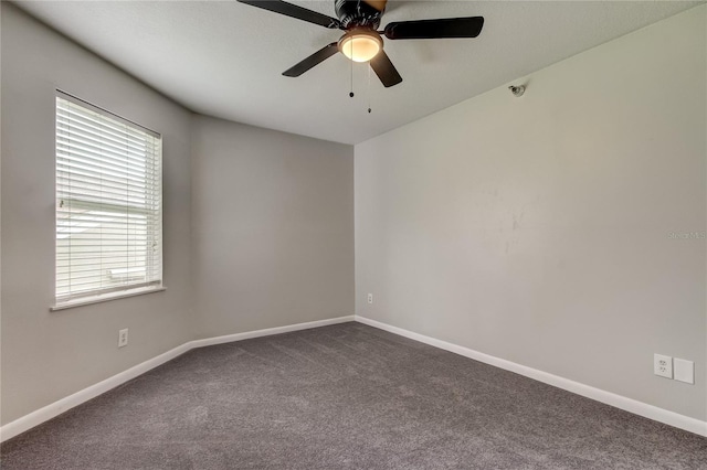 carpeted empty room featuring ceiling fan