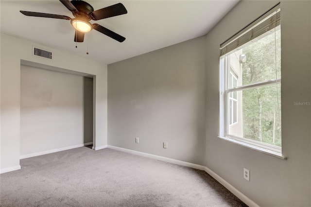 unfurnished room featuring carpet flooring and ceiling fan