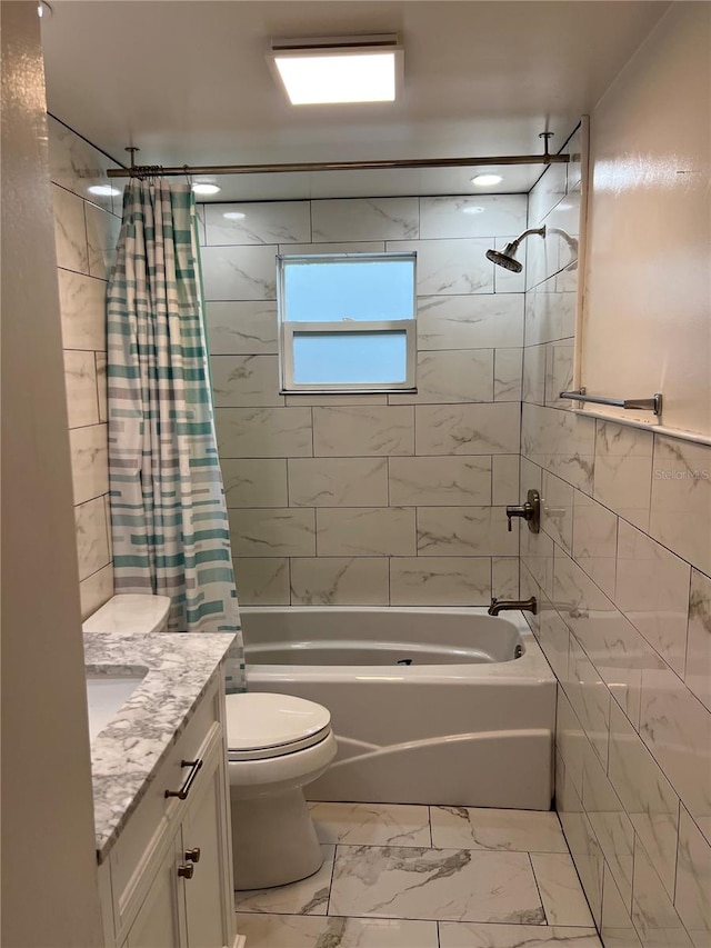 full bathroom with vanity, tile walls, toilet, and shower / bathtub combination with curtain