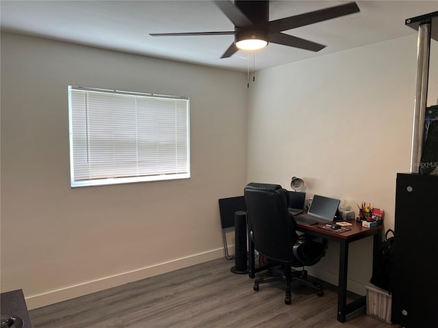 office space with dark hardwood / wood-style floors and ceiling fan