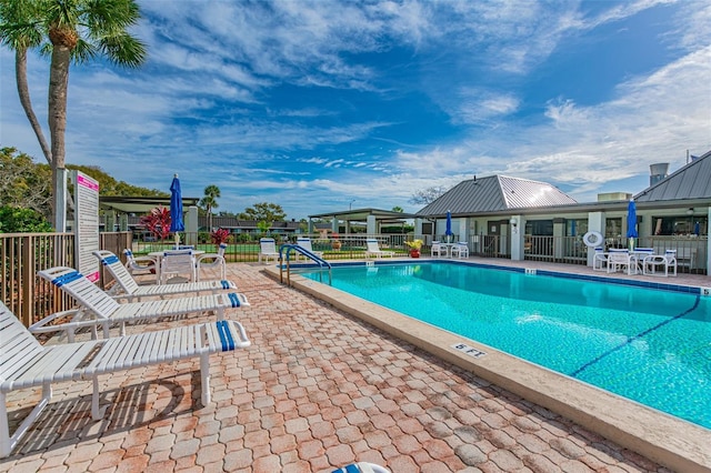 view of pool featuring a patio area