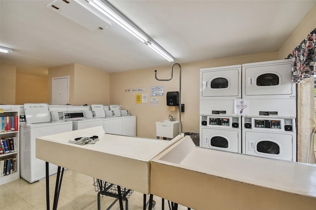 clothes washing area with stacked washer / dryer and washer and clothes dryer