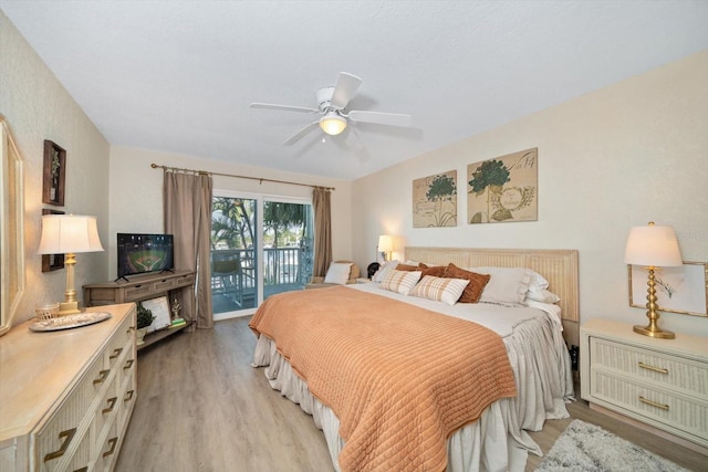 bedroom featuring ceiling fan, light hardwood / wood-style floors, and access to exterior