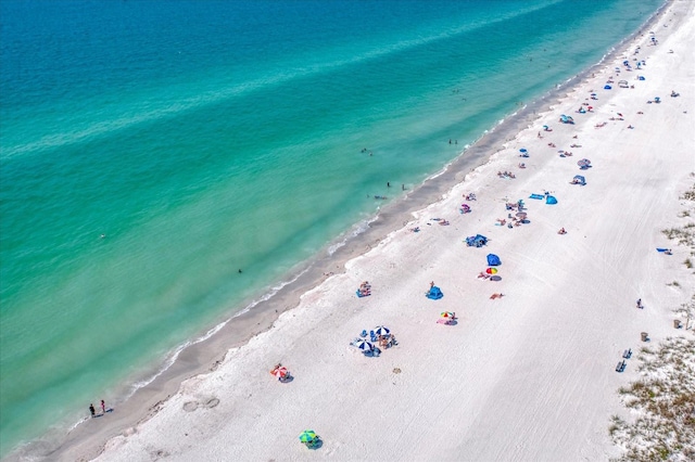 birds eye view of property featuring a water view and a view of the beach