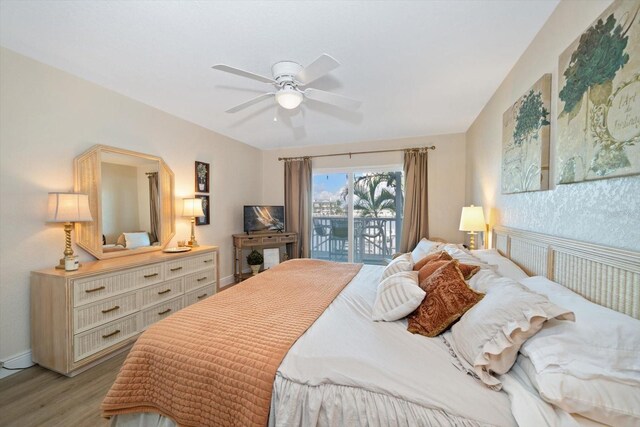 bedroom with light hardwood / wood-style flooring, ceiling fan, and access to outside