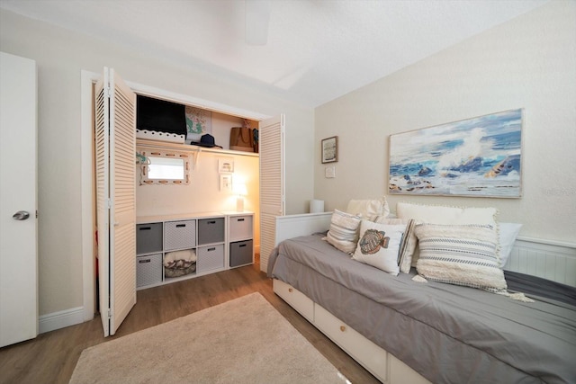 bedroom featuring dark hardwood / wood-style flooring and ceiling fan