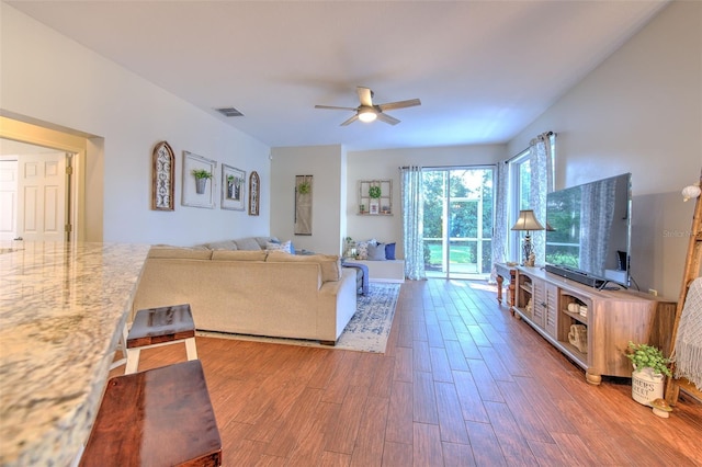 4923 Willow Ridge Ter, Valrico, FL 33596 - living area featuring visible vents, ceiling fan, and wood finished floors