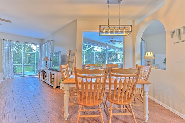 dining area featuring ceiling fan, hardwood / wood-style flooring, and a healthy amount of sunlight