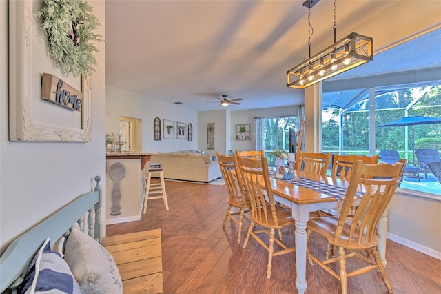 dining area featuring ceiling fan and hardwood / wood-style flooring