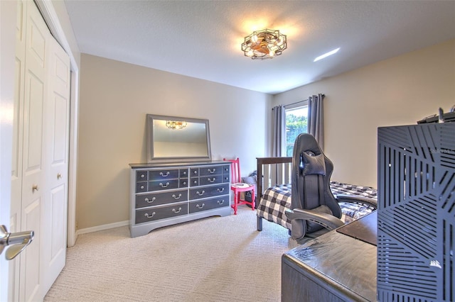 office area featuring light colored carpet and a textured ceiling