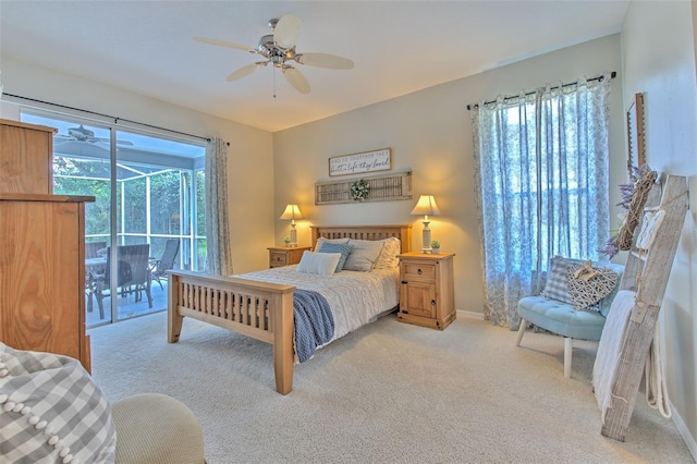 carpeted bedroom featuring ceiling fan and access to exterior