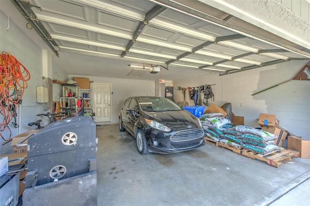 4923 Willow Ridge Ter, Valrico, FL 33596 - garage featuring a garage door opener and concrete block wall