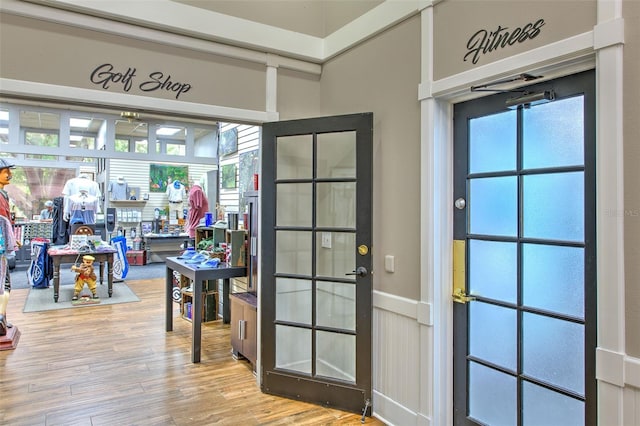 entryway with hardwood / wood-style floors