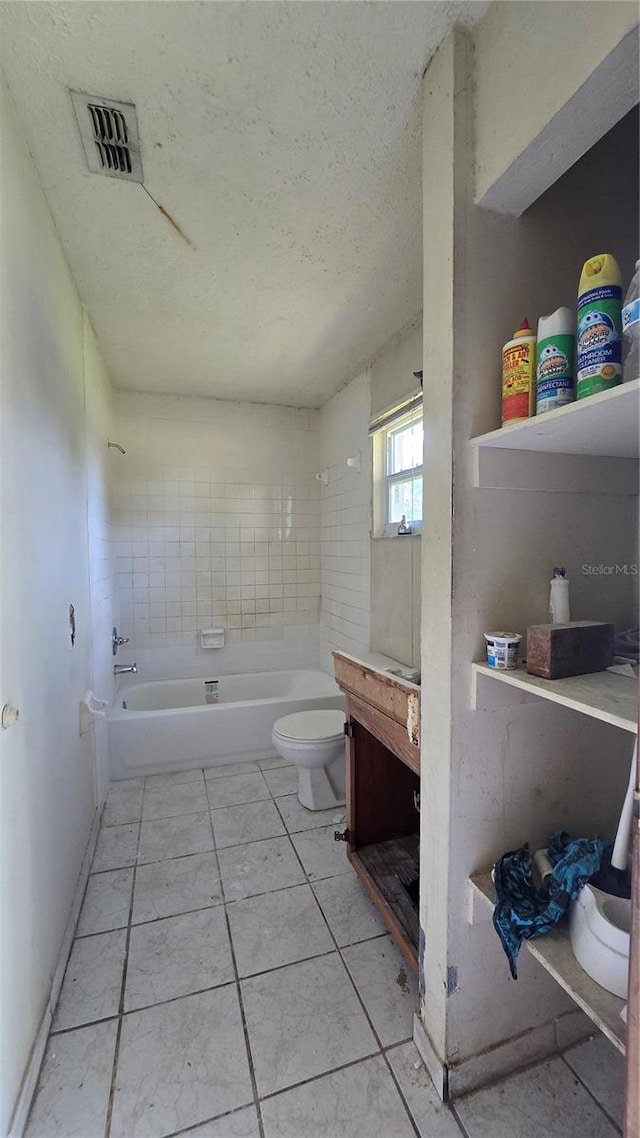 bathroom featuring independent shower and bath, a textured ceiling, toilet, and tile patterned floors