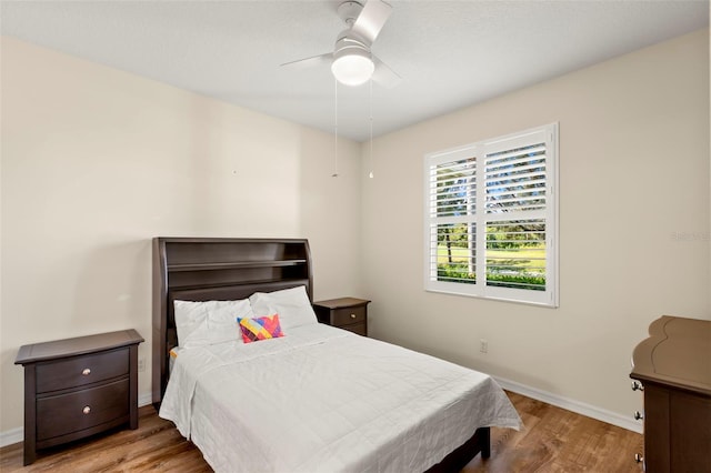 bedroom featuring ceiling fan and light hardwood / wood-style floors