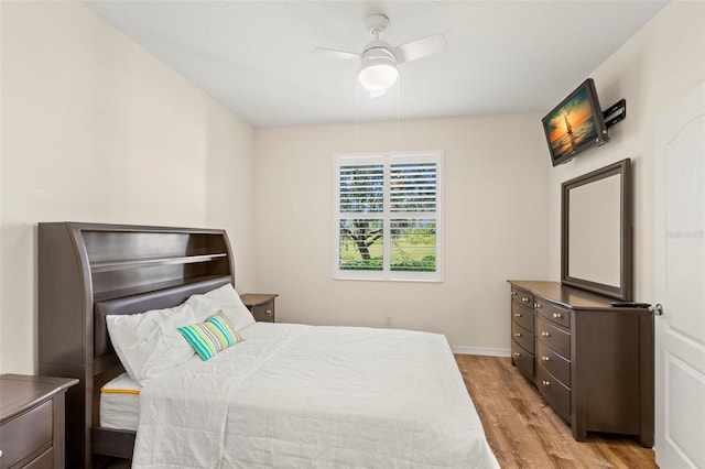 bedroom with light wood-type flooring and ceiling fan