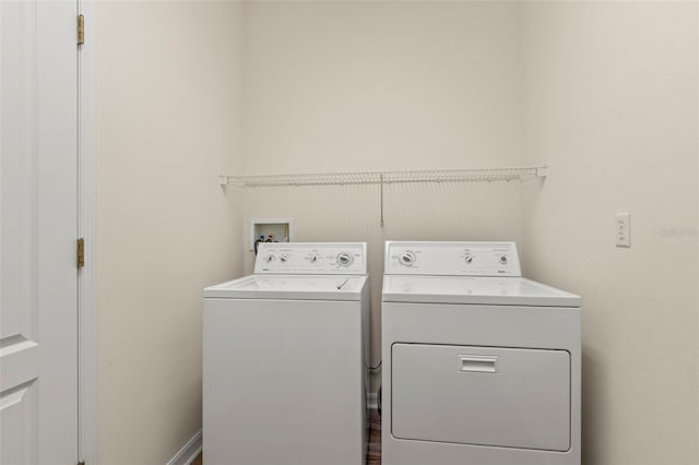 laundry area with washing machine and dryer