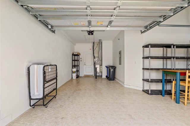 garage featuring a garage door opener, electric panel, and water heater