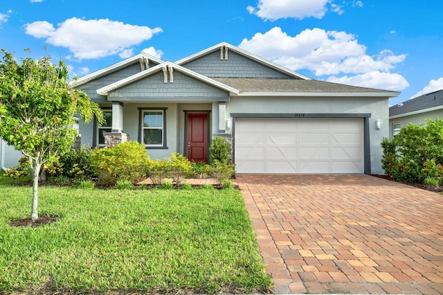 view of front of property featuring a garage and a front yard