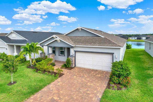 view of front of house featuring a front yard and a garage