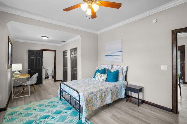 bedroom with ceiling fan, hardwood / wood-style floors, ensuite bathroom, and crown molding