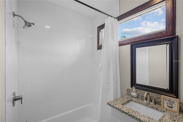 bathroom with shower / bath combination with curtain and vanity